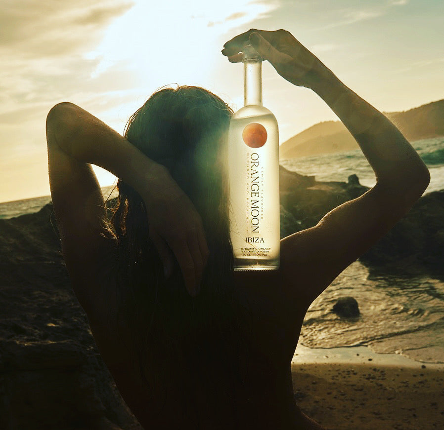 Premium vodka in gold-filtered bottle with mandarin orange flavor